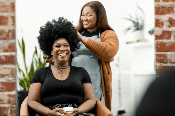 Stylist working with a client in a beauty salon