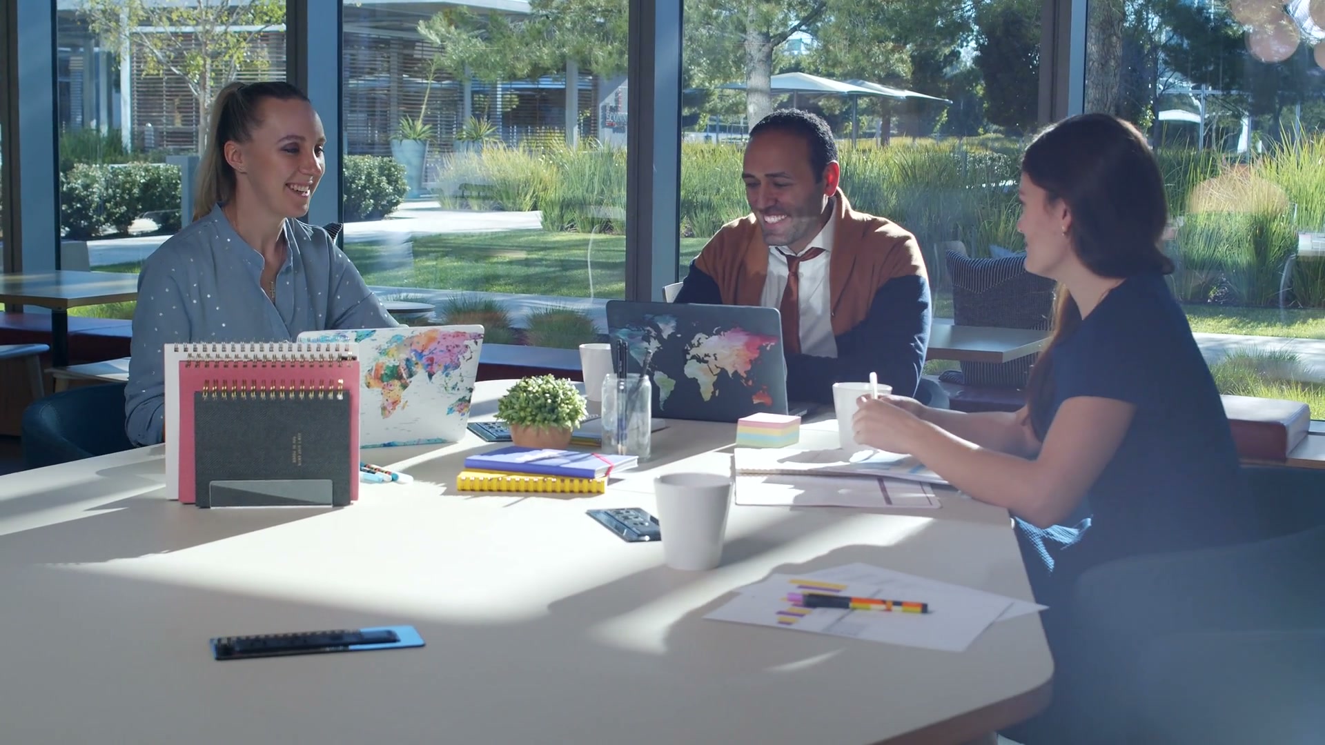 A team enjoying a conversation around a table