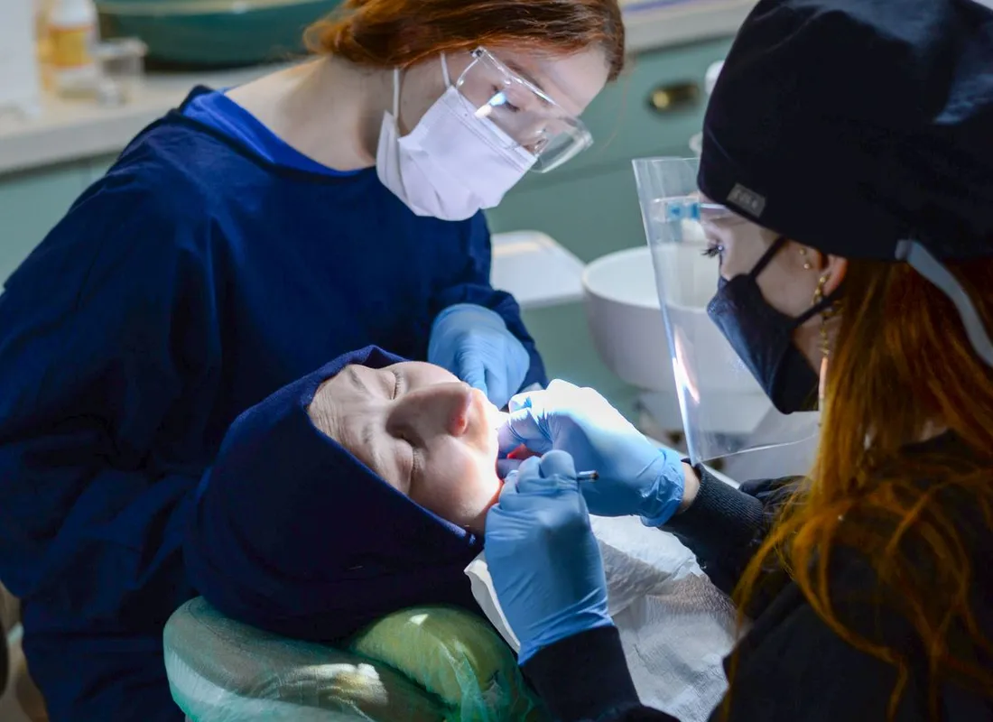 Dental team caring for a patient in a modern clinic