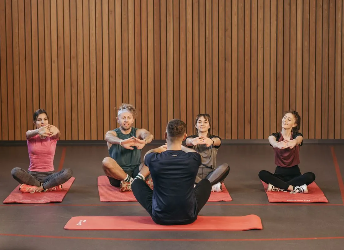 Instructor leading a mindful movement class in a studio